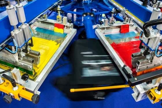 Custom apparel production used to compare screen printing and DTF options